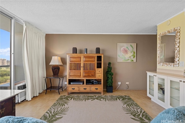 tiled living room featuring a textured ceiling