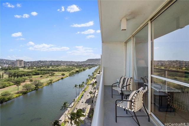 balcony featuring a water view