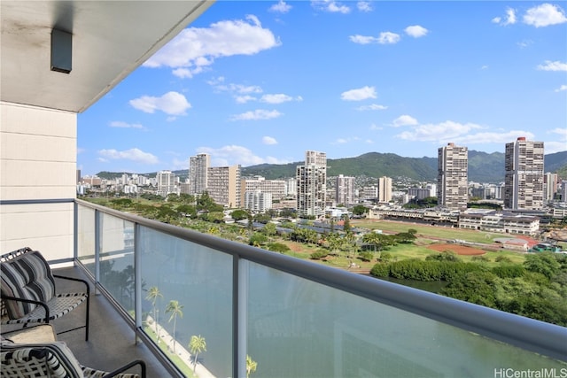 balcony featuring a mountain view