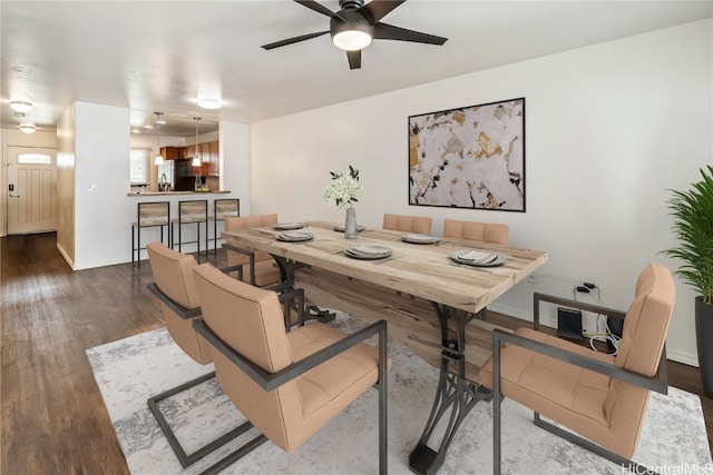 dining space featuring ceiling fan and hardwood / wood-style flooring