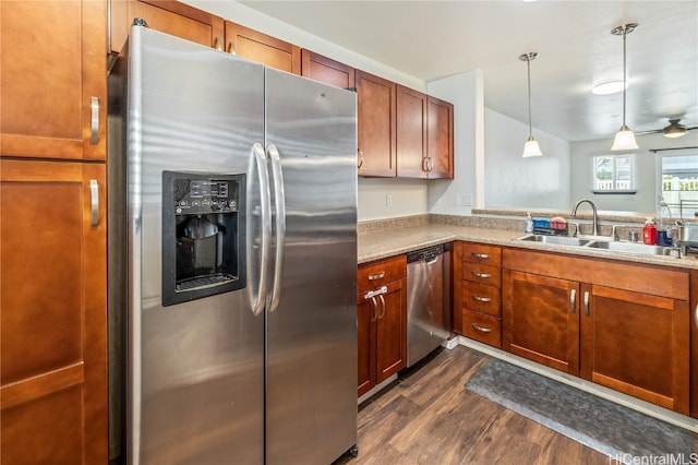 kitchen with hanging light fixtures, sink, ceiling fan, appliances with stainless steel finishes, and dark hardwood / wood-style flooring