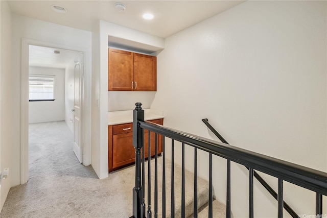 443 Manawai St Unit 1503, Kapolei, HI 96707 - hallway with light colored carpet, an upstairs landing, and recessed lighting
