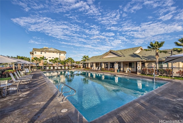 view of swimming pool featuring a patio area