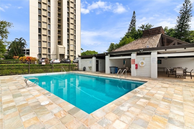 view of pool featuring a patio area