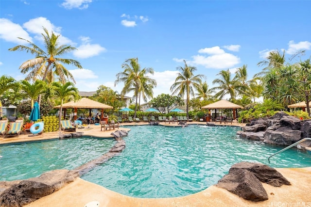 view of swimming pool featuring a patio area and a gazebo