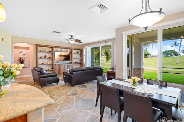 dining room featuring ceiling fan