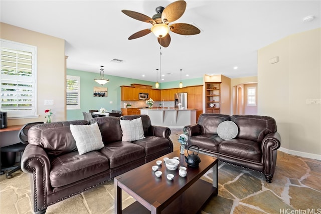 living room featuring ceiling fan