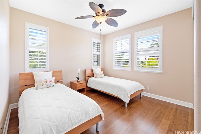 bedroom featuring hardwood / wood-style flooring and ceiling fan