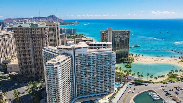 drone / aerial view with a water view and a view of the beach