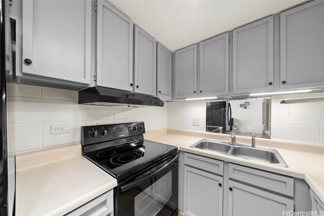 kitchen featuring gray cabinets, black electric range oven, and sink