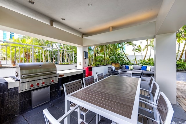 view of patio featuring an outdoor kitchen, grilling area, and an outdoor hangout area