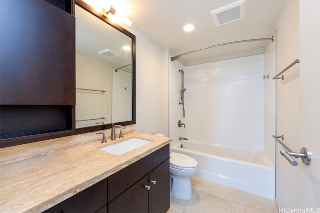 full bathroom with tiled shower / bath combo, vanity, tile patterned flooring, and toilet