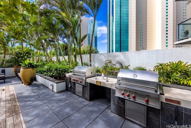 view of patio with area for grilling and grilling area