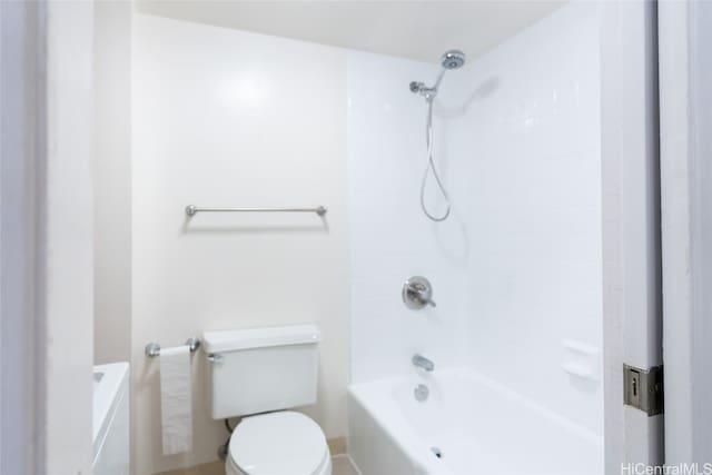 bathroom with bathing tub / shower combination and toilet