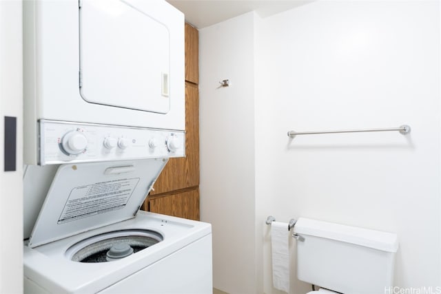 washroom with stacked washer / drying machine