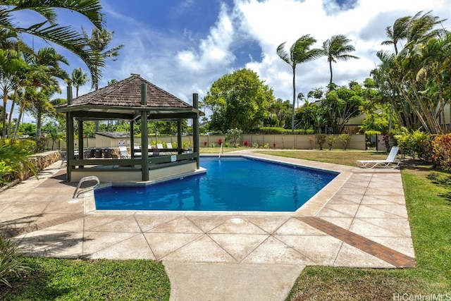 view of swimming pool with a gazebo and a patio area