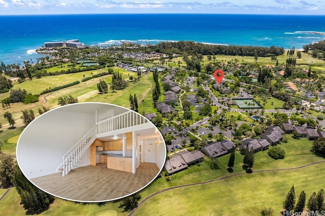 birds eye view of property with a water view