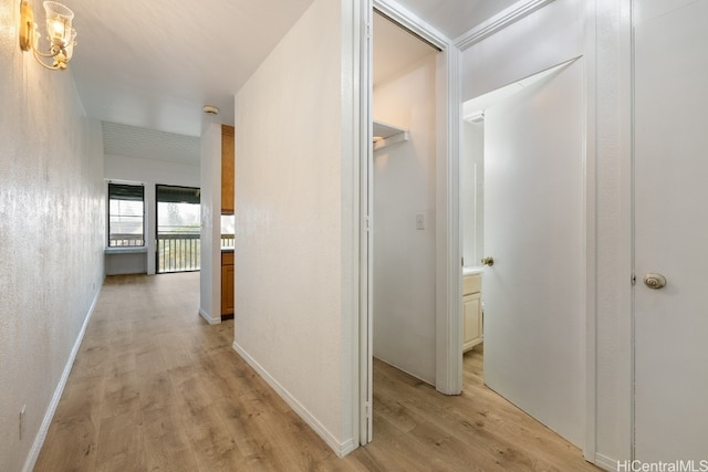 hallway with light wood-type flooring