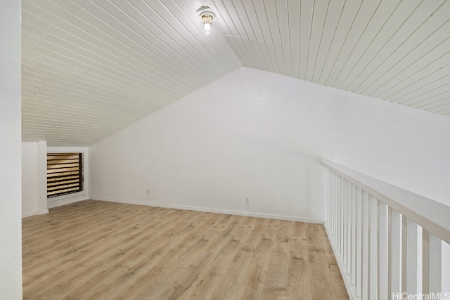 additional living space featuring wood ceiling, light hardwood / wood-style floors, and lofted ceiling