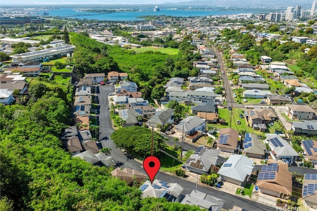 drone / aerial view featuring a water view and a residential view