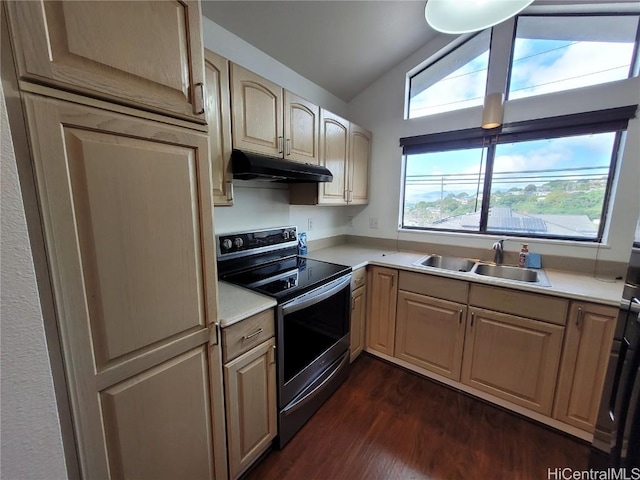 kitchen featuring electric stove, vaulted ceiling, light countertops, under cabinet range hood, and a sink