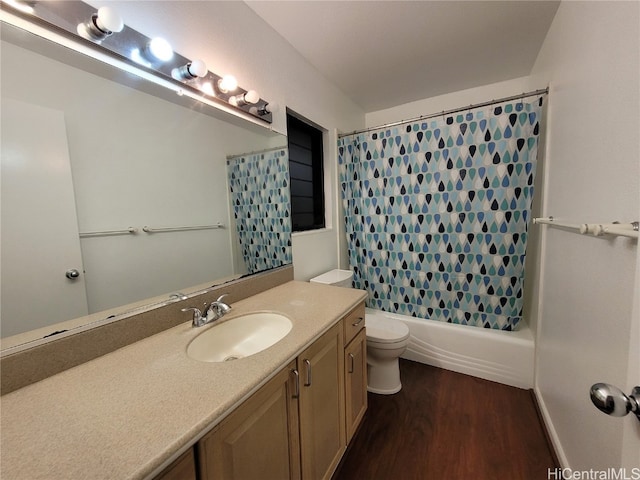 full bath with vanity, shower / bath combination with curtain, wood finished floors, and toilet