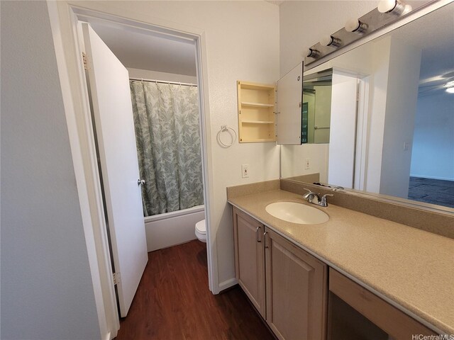 99-733 Meaala St, Aiea, HI 96701 - full bathroom featuring wood finished floors, toilet, vanity, and shower / bathtub combination with curtain