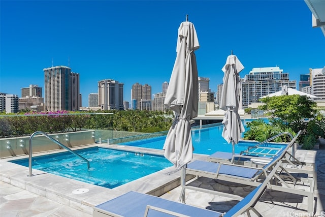 view of pool with a community hot tub