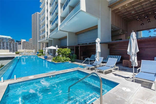 view of swimming pool featuring a patio