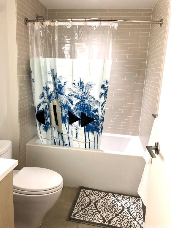 full bathroom featuring shower / bath combo, vanity, tile patterned floors, and toilet