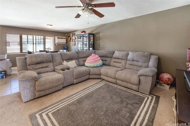 carpeted living room featuring an AC wall unit, ceiling fan, and a textured ceiling