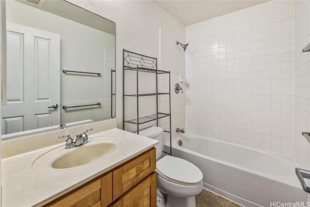 full bathroom with shower / washtub combination, tile patterned flooring, vanity, and toilet