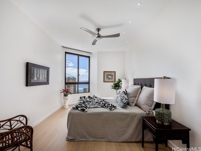 bedroom featuring ceiling fan and light hardwood / wood-style floors