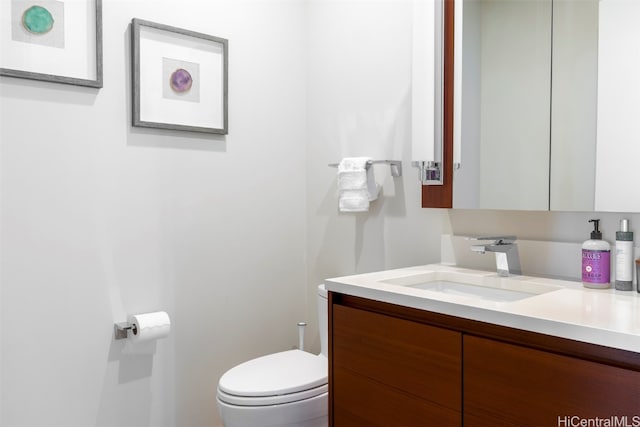 bathroom with vanity and toilet