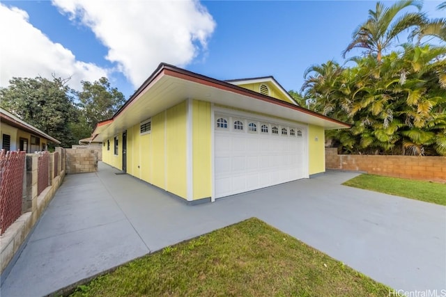 view of property exterior featuring a garage