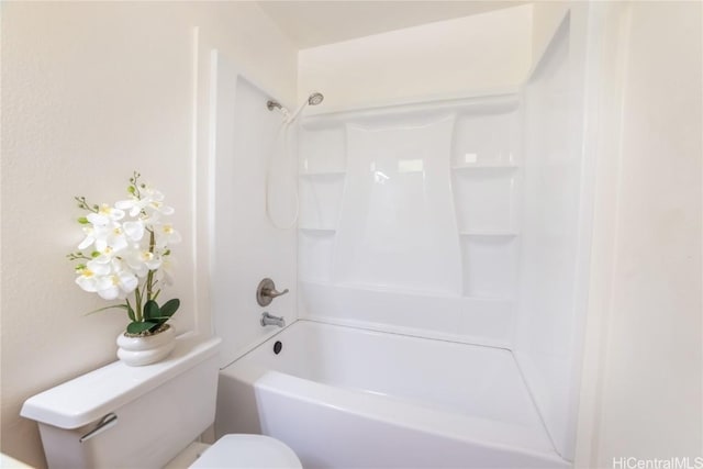 bathroom featuring toilet and shower / tub combination