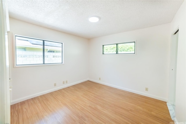 83 Iho Iho Pl, Wahiawa, HI 96786 - spare room featuring light wood-style flooring and a textured ceiling