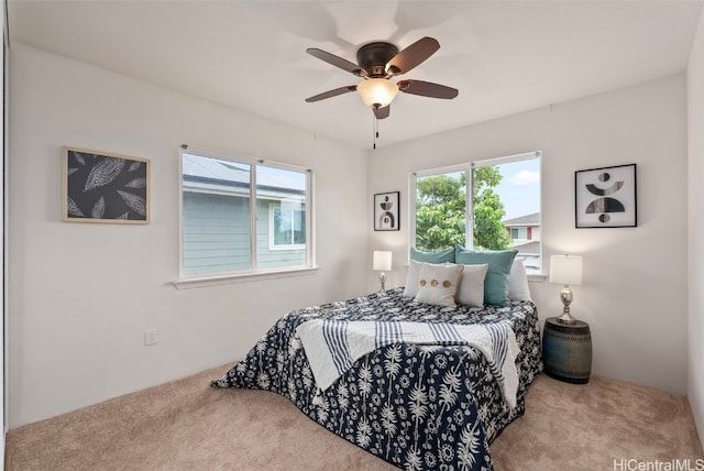 carpeted bedroom with ceiling fan