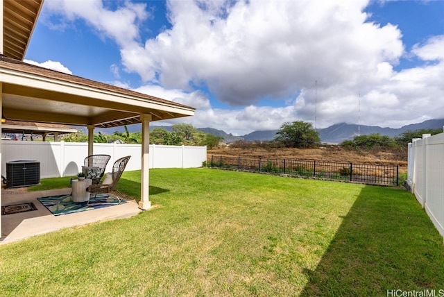 view of yard featuring a mountain view and a patio area