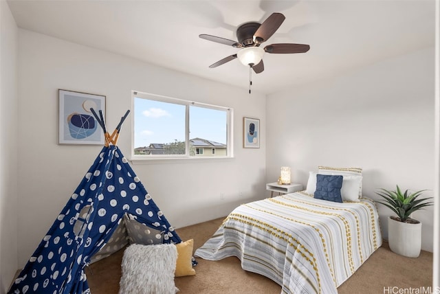 bedroom with ceiling fan and carpet