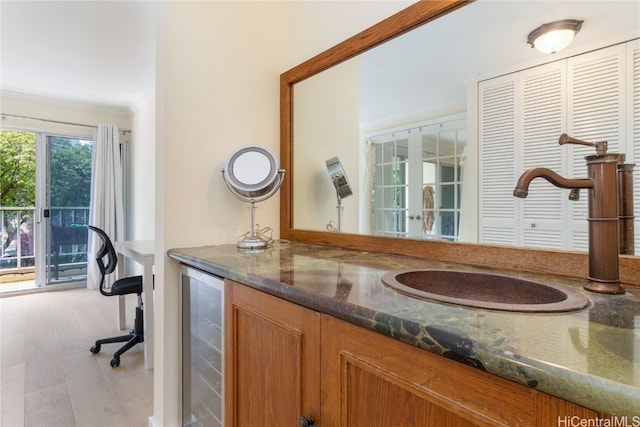 bathroom with vanity and beverage cooler