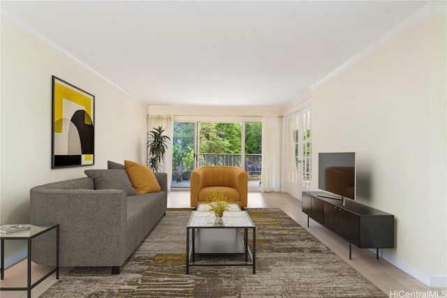 living room with hardwood / wood-style flooring and ornamental molding