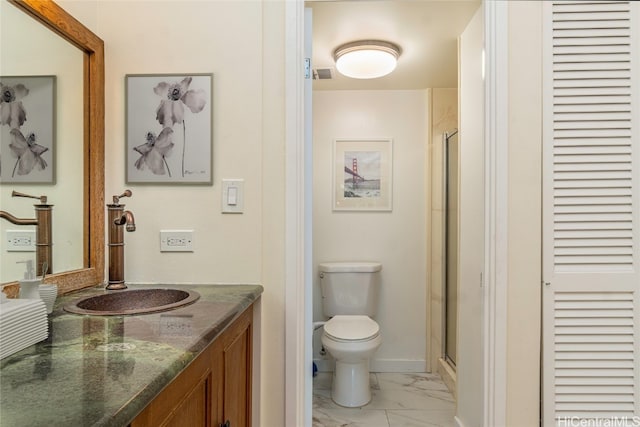 bathroom with vanity, toilet, and walk in shower