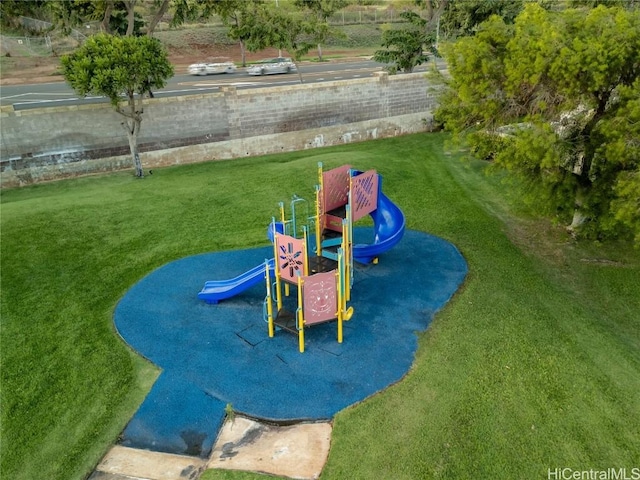 view of jungle gym featuring a lawn