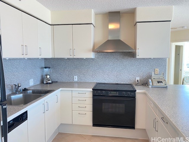 kitchen with white cabinetry, white dishwasher, wall chimney range hood, and black range with electric cooktop