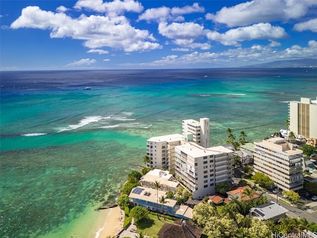 drone / aerial view with a water view and a beach view