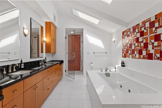 bathroom featuring vanity, independent shower and bath, tile patterned flooring, and vaulted ceiling with beams