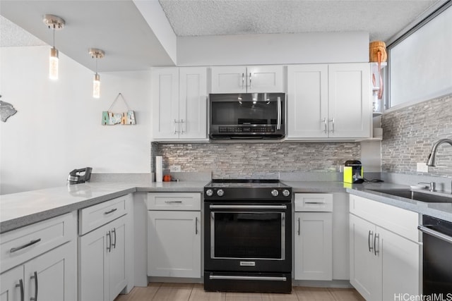 kitchen featuring white cabinets and electric range oven