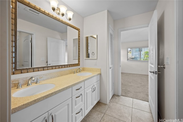 bathroom with tile patterned flooring and vanity