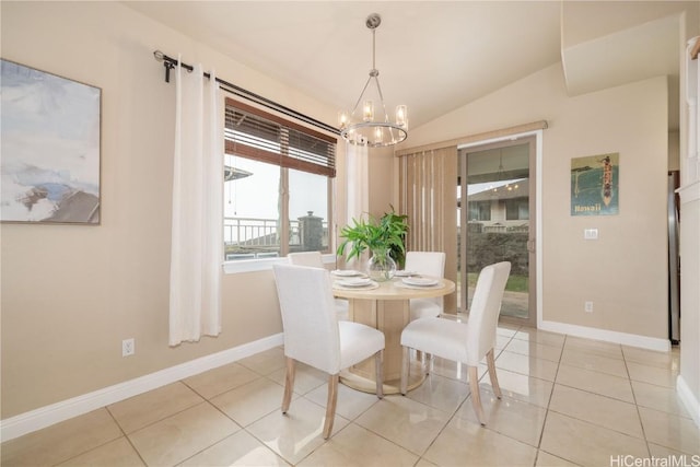 tiled dining room featuring a chandelier and lofted ceiling